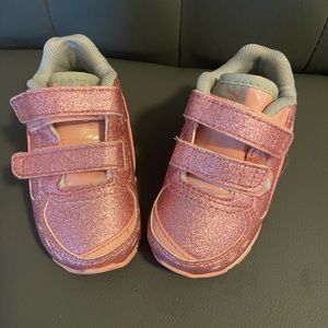 Pink sparkly Puma sneakers with velcro straps